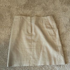 Ann Taylor brand, tan skirt with zipper and belt holder, (fake pockets).